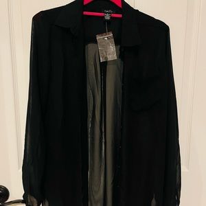 Sheer black oversized button down top.